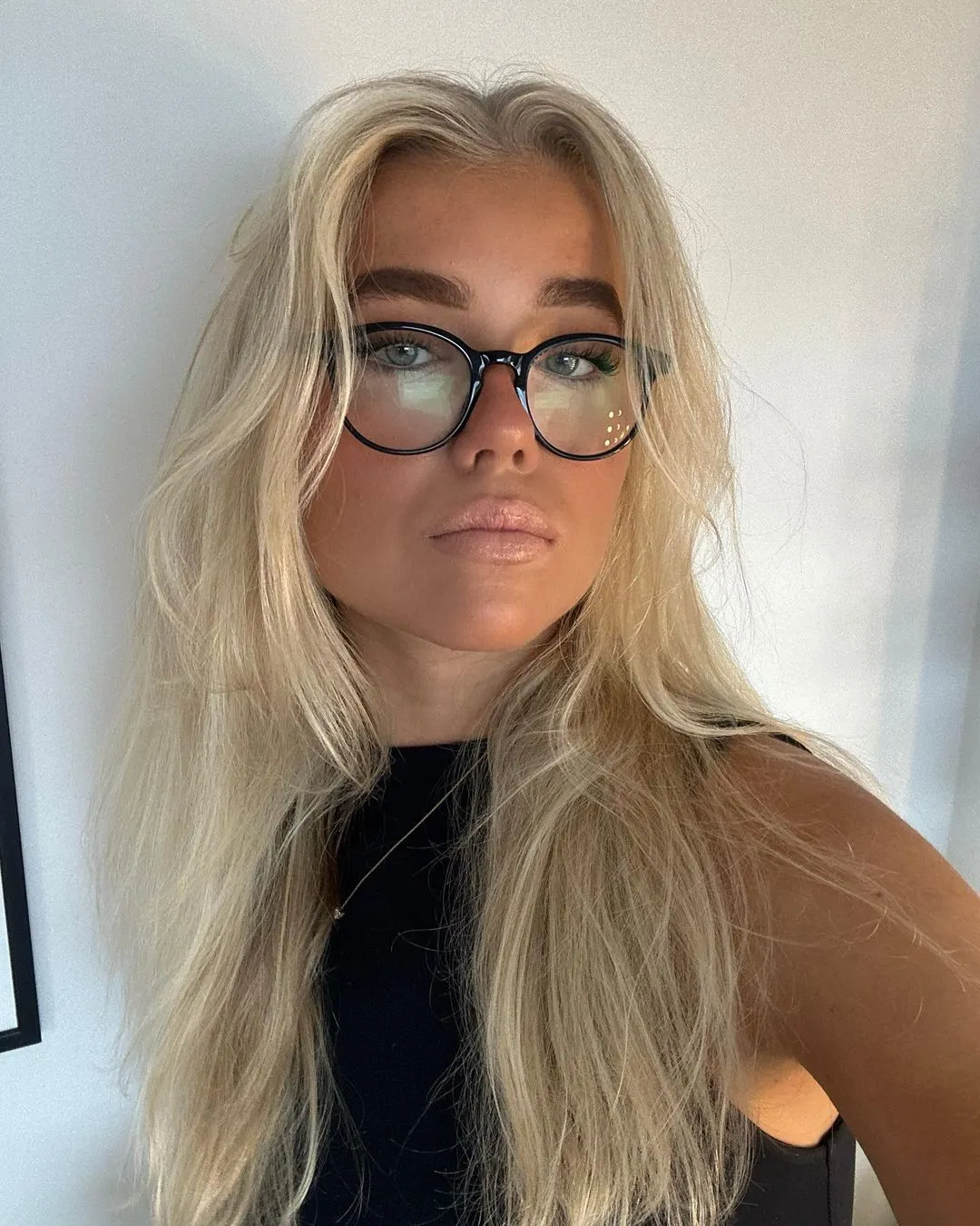 Woman with glasses taking a selfie